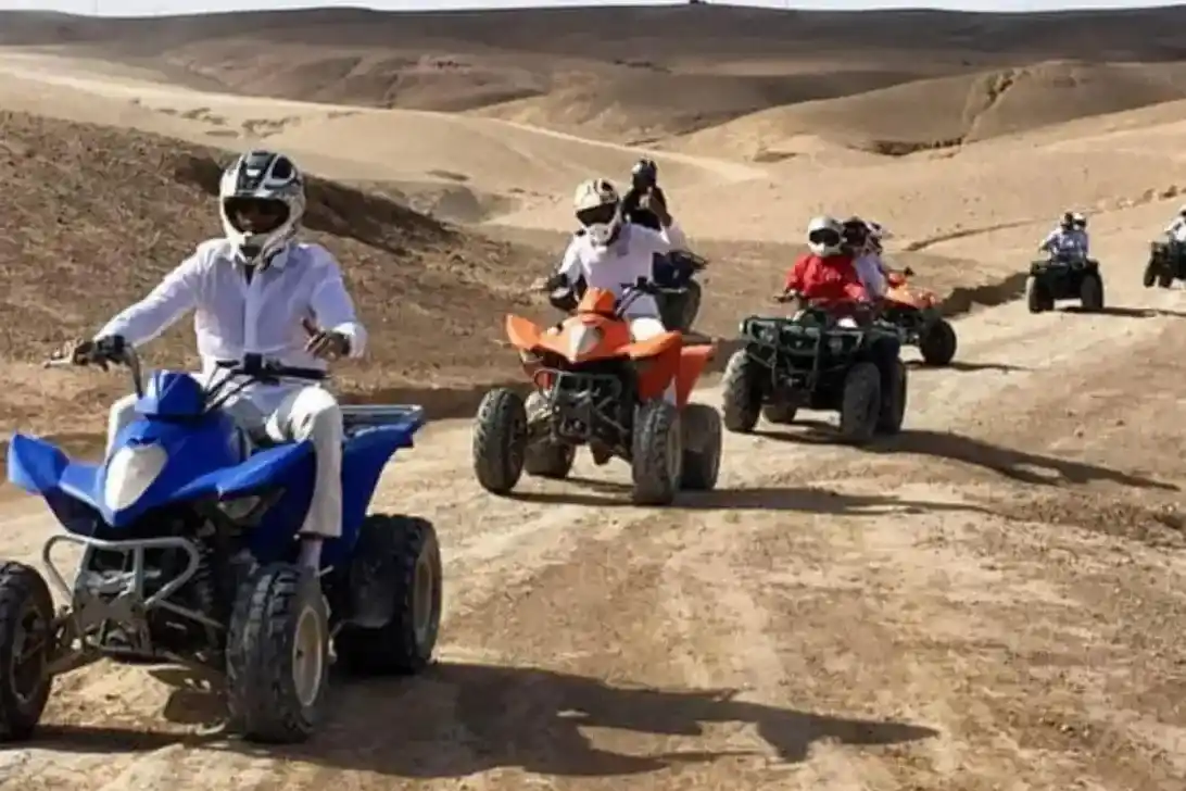 Quad biking tour in the Agafay Desert near Marrakech with riders exploring rocky desert trails
