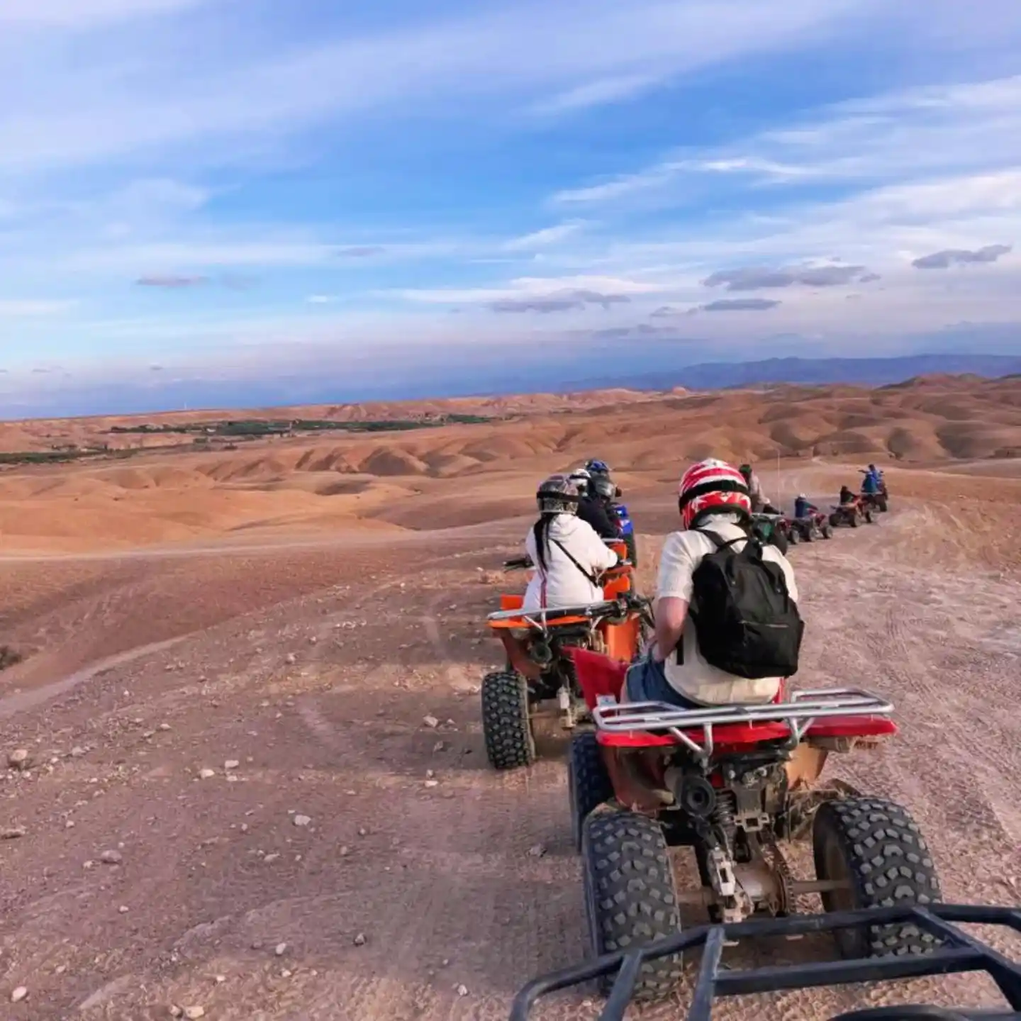 Quad bike tour crossing the rocky landscapes of the Agafay Desert near Marrakech