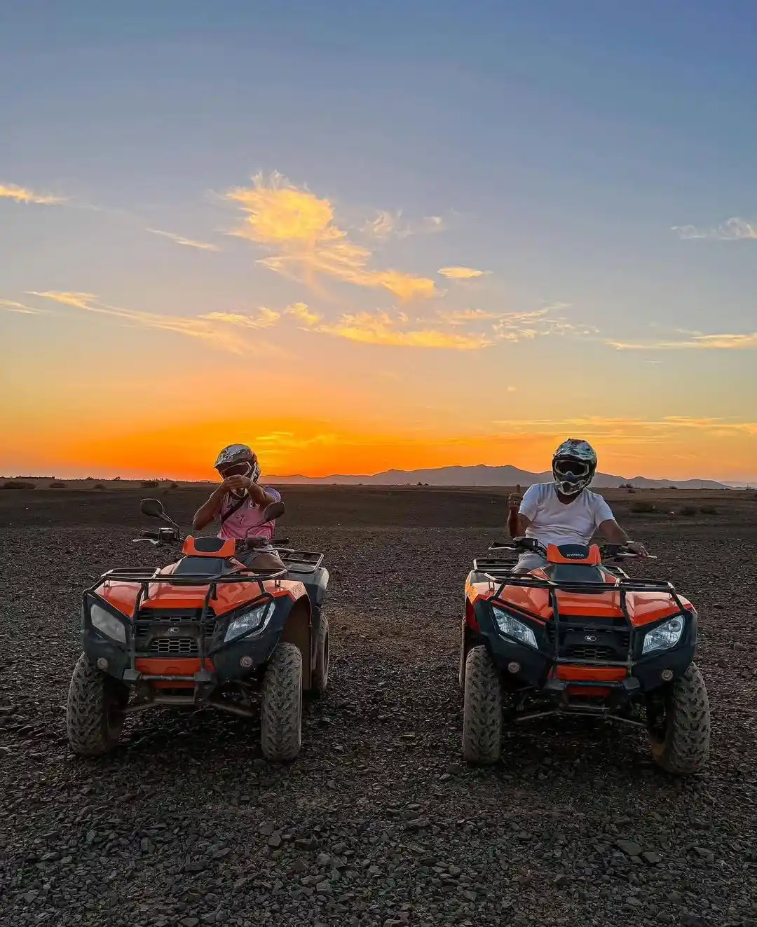 Quad biking at sunset in the Agafay Desert with stunning views of the Moroccan landscape