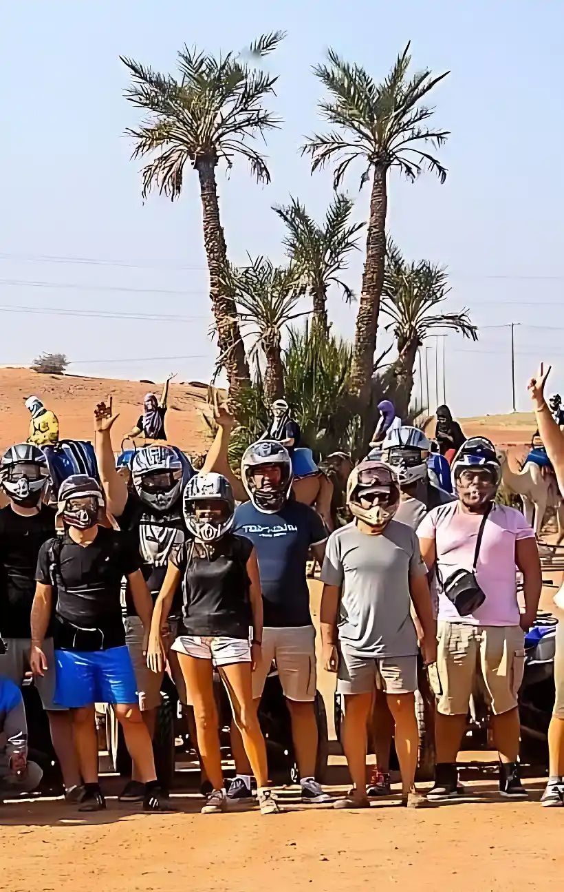 Tourists participating in a buggy and camel ride experience in Marrakech Palmeraie