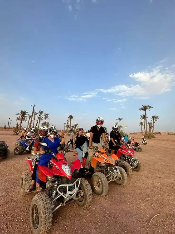 Family enjoying a quad bike tour in the Marrakech Palmeraie during a guided adventure