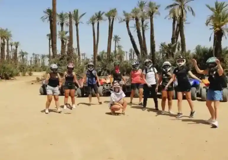 Group of quad bike riders gathering in Marrakech Palmeraie before the tour